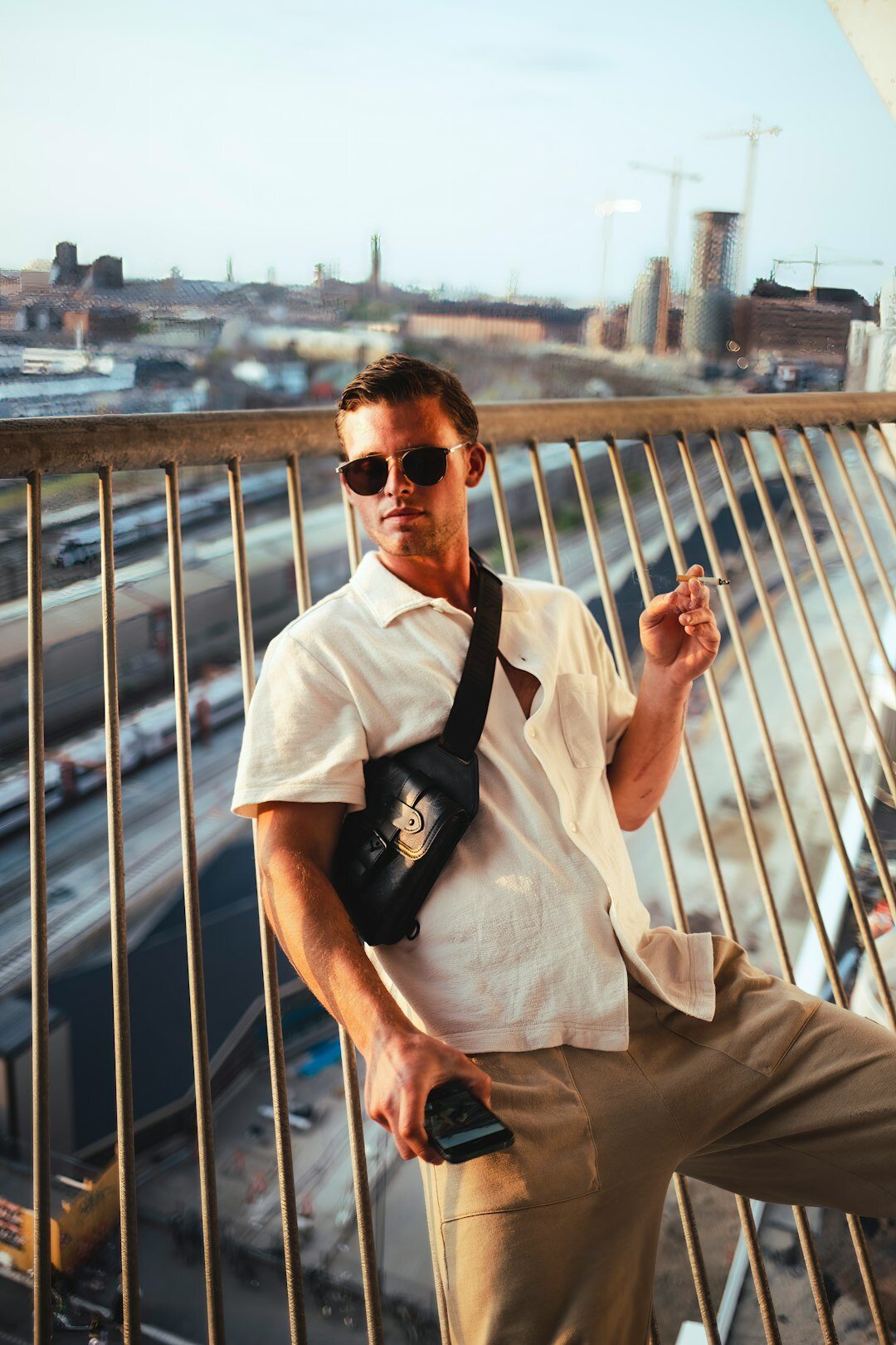 Portrait of a Danish documentary photographer holding a camera